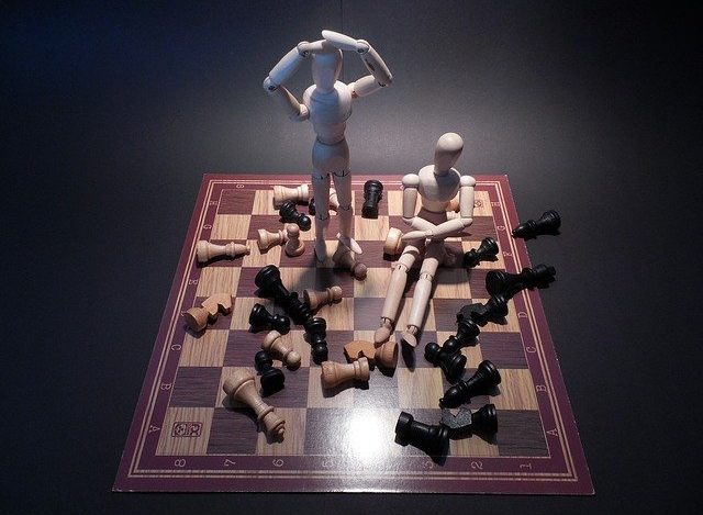 wooden figures win and lose